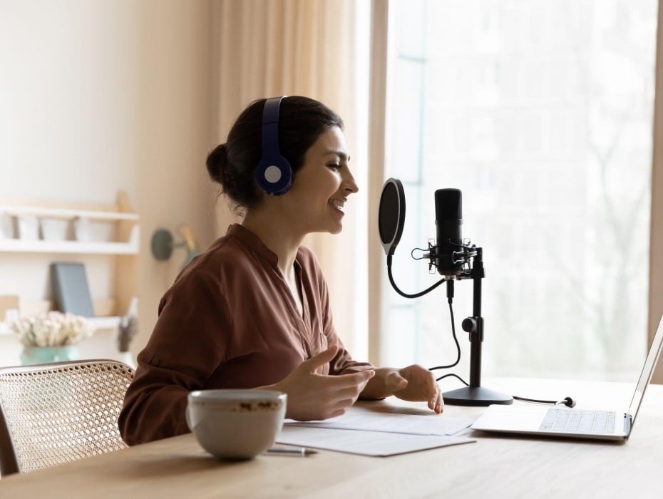 rehearsing for a virtual event at a table