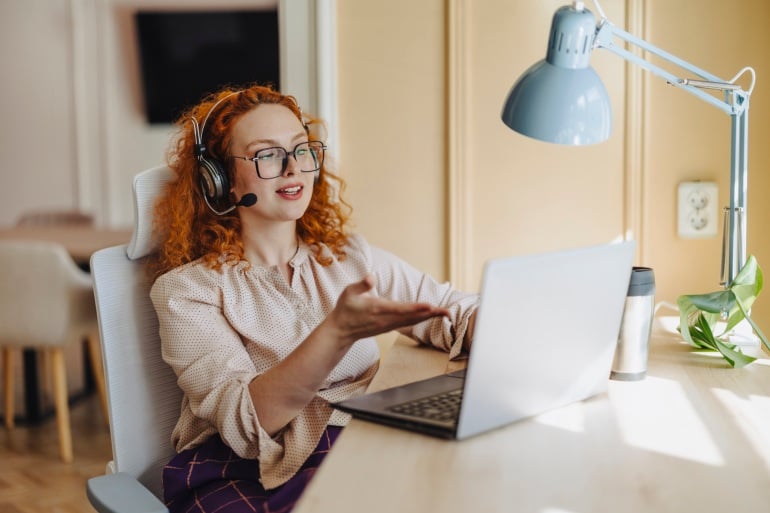 woman participating in a virtual event at home