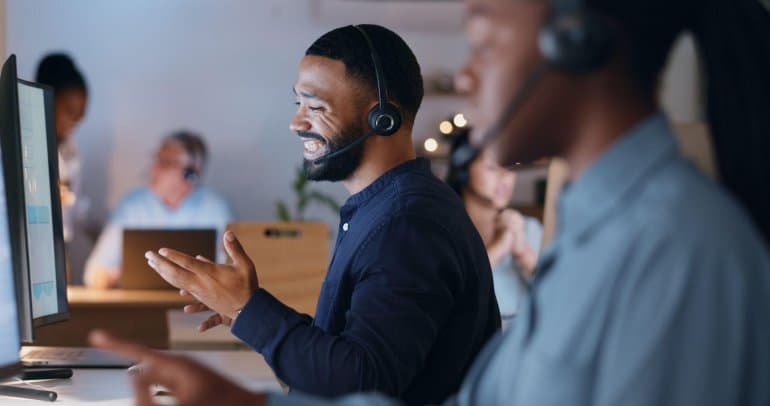 customer service team using top omnichannel communications solutions with headsets in a call center