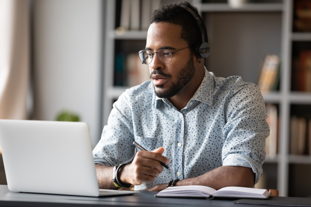 A male employee undergoing training for new AI software